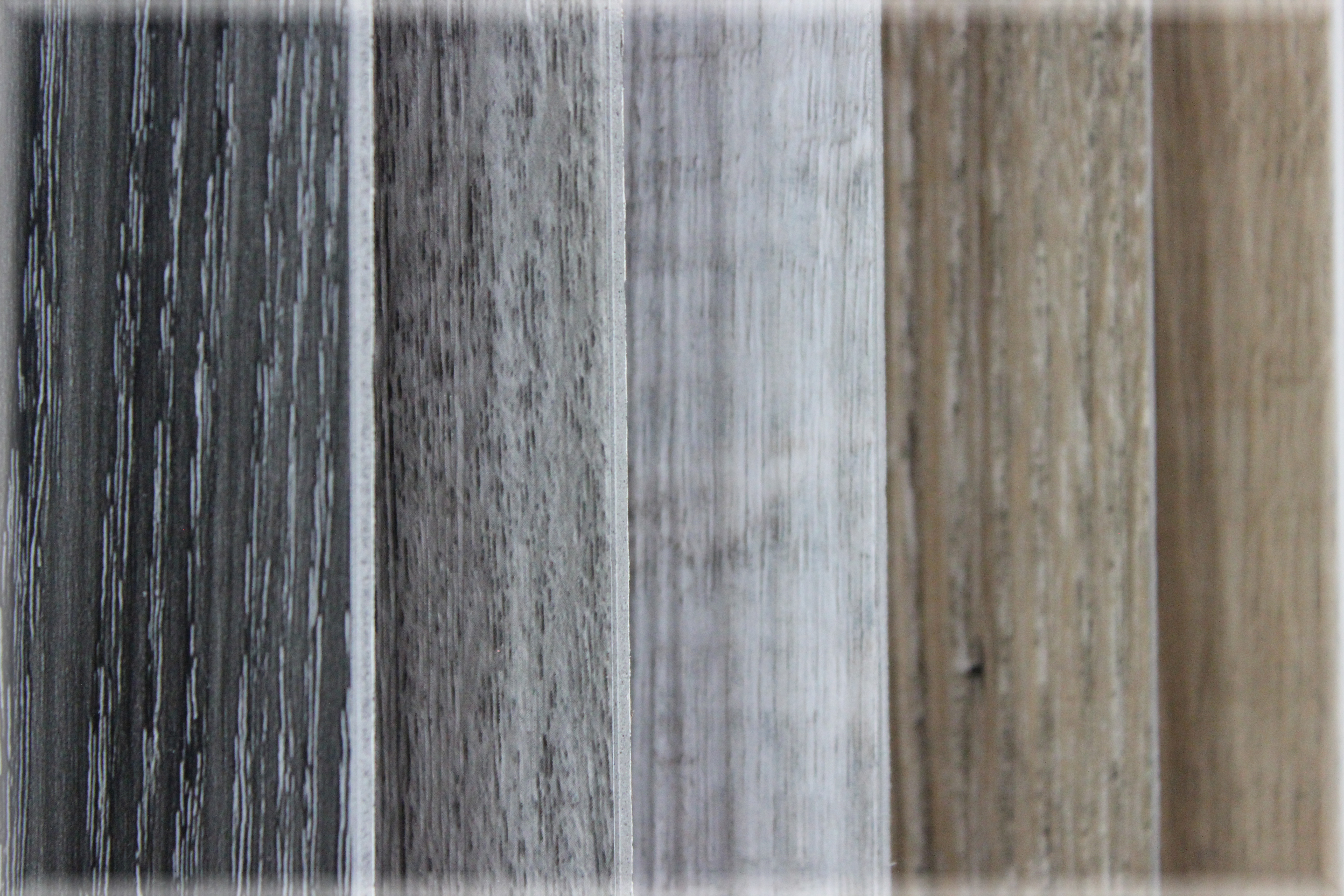 picture of multiple vinyl plank flooring samples