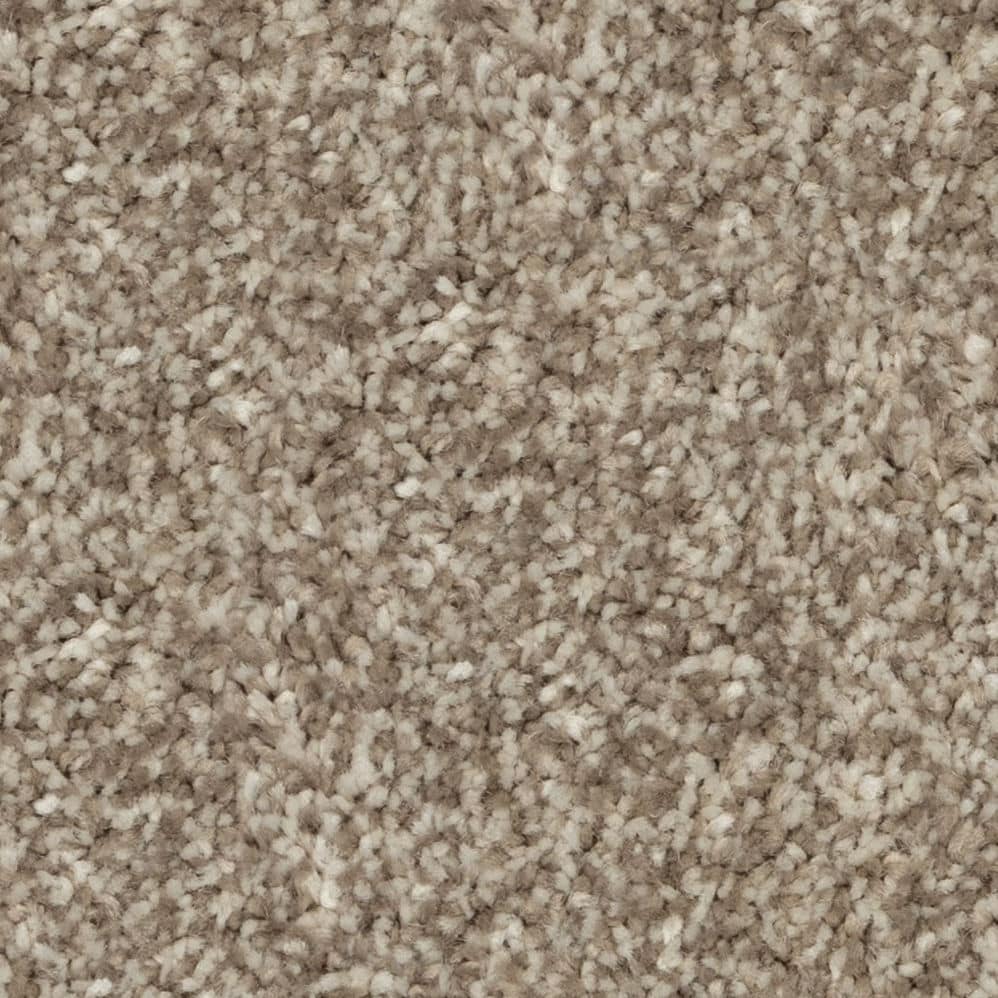 Close-up of beige textured carpet fibers