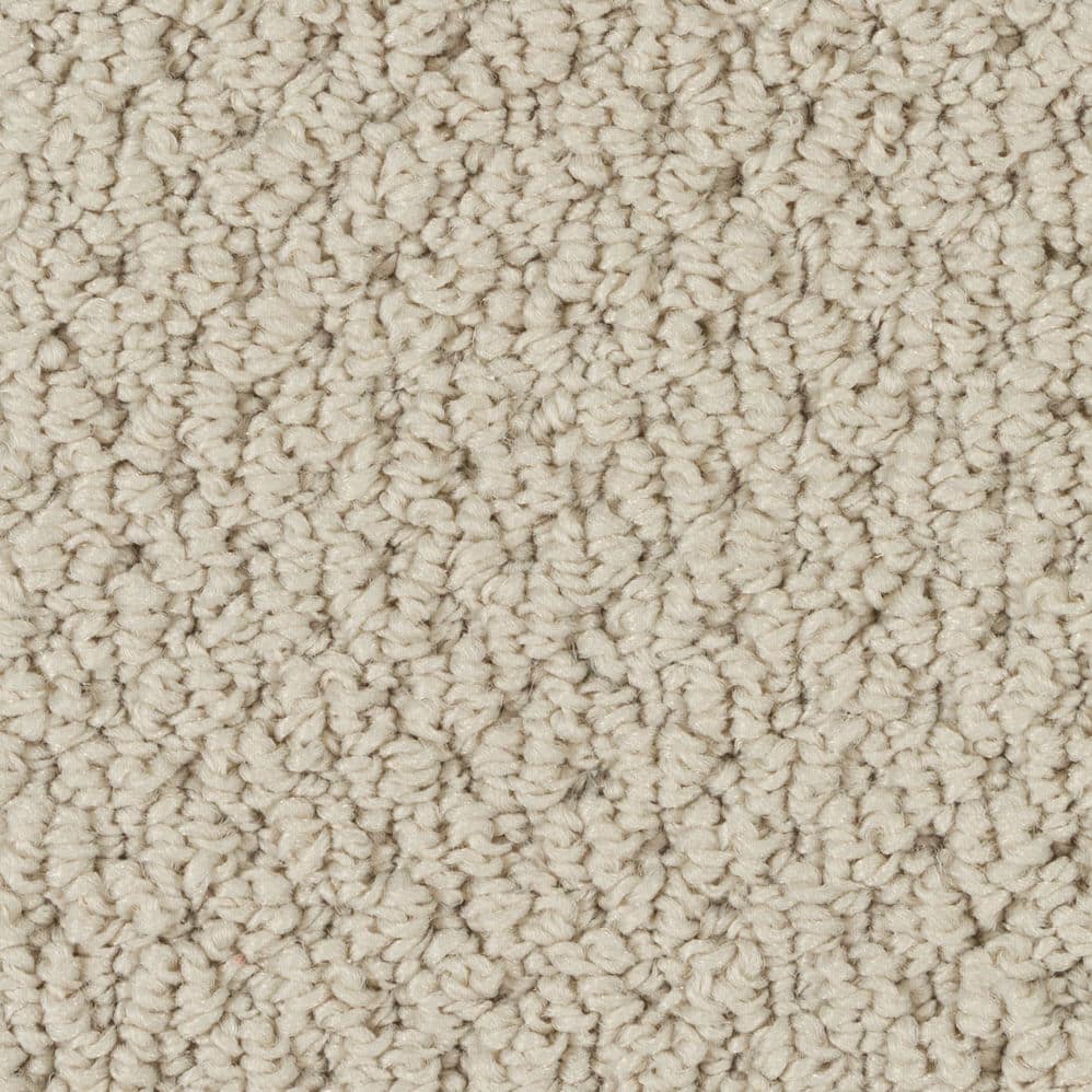Close-up of beige textured carpet fibers