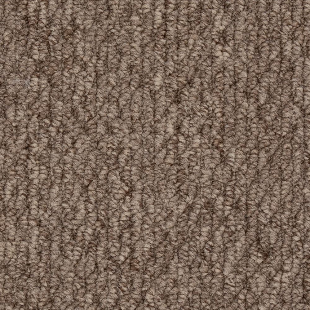 Close-up of brown textured carpet fibers