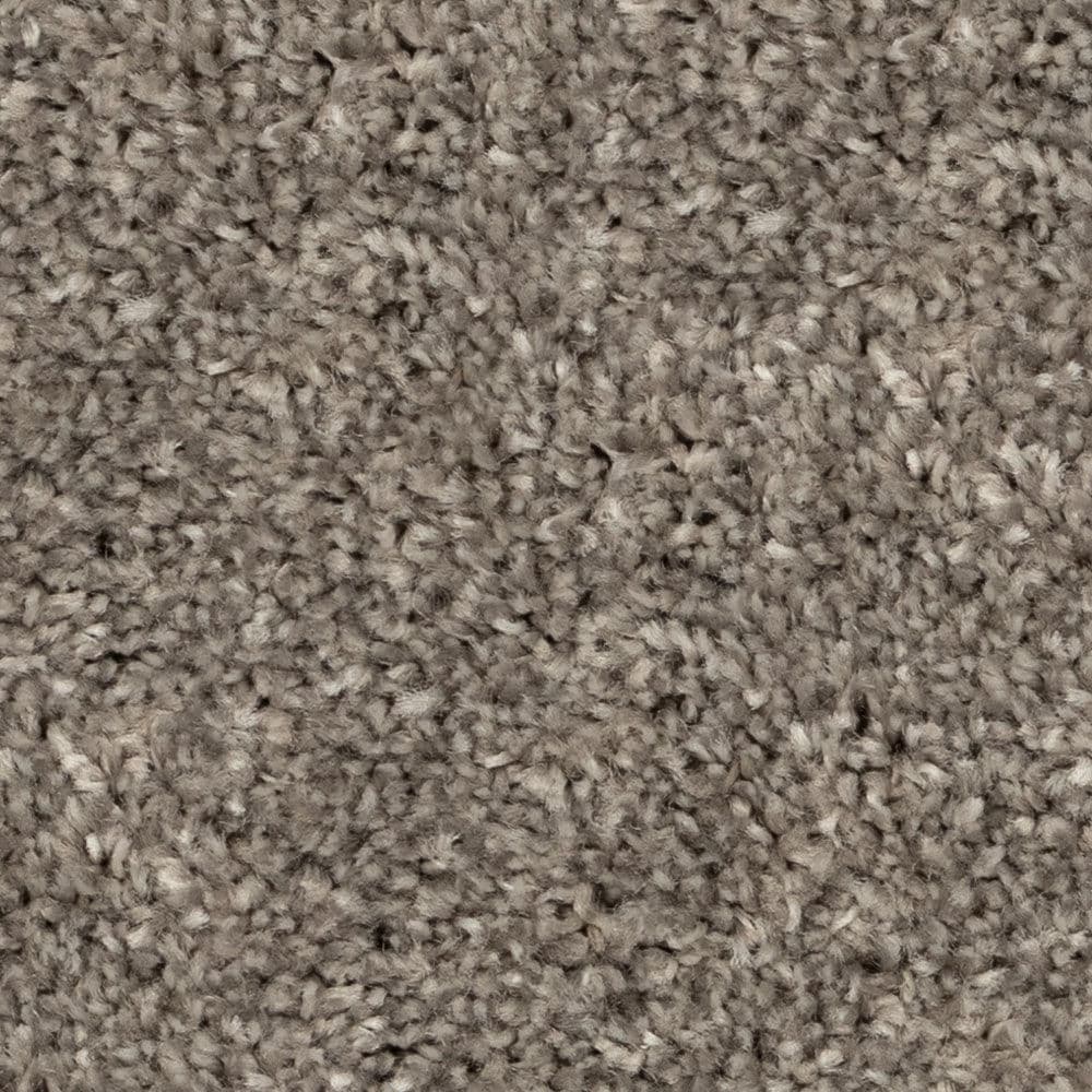 Close-up of beige textured carpet fibers