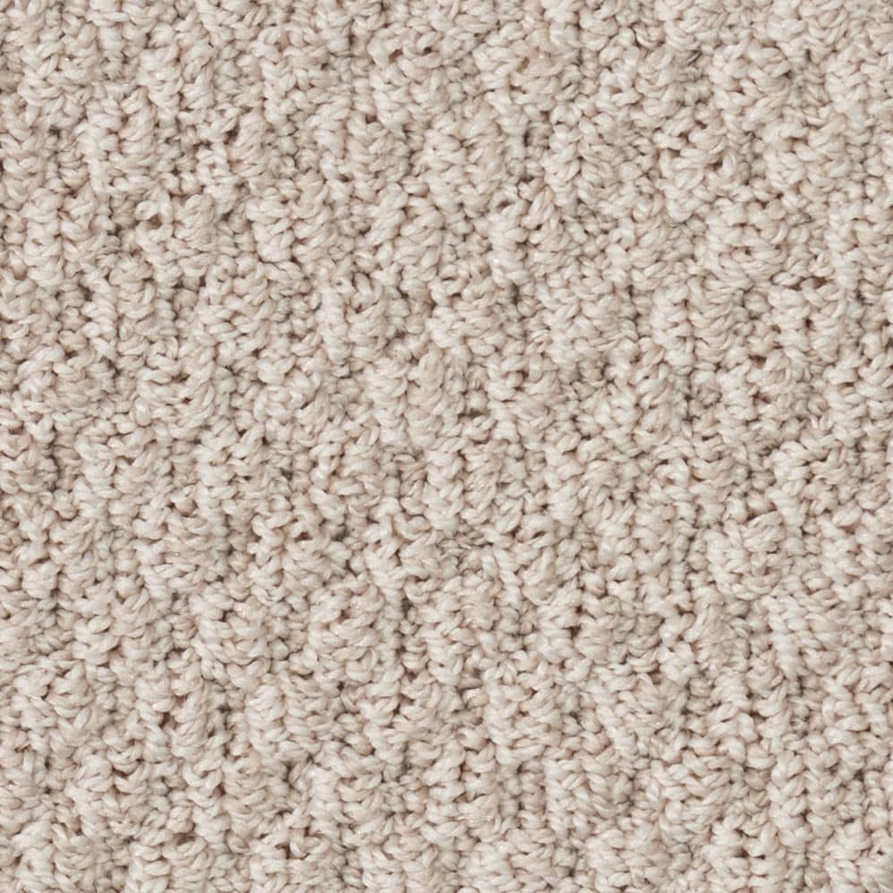 Close-up of beige textured carpet fibers