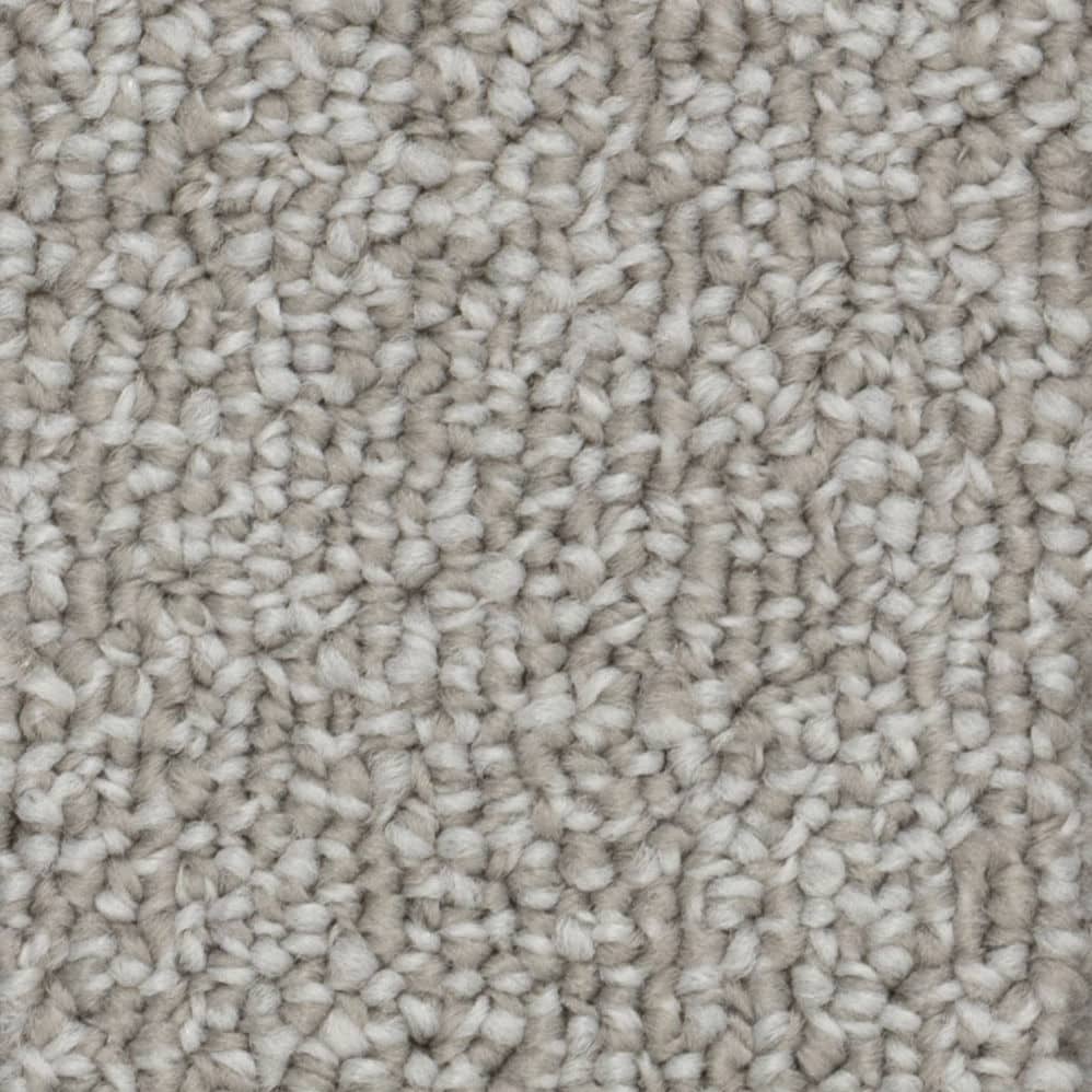 Close-up of beige looped carpet texture