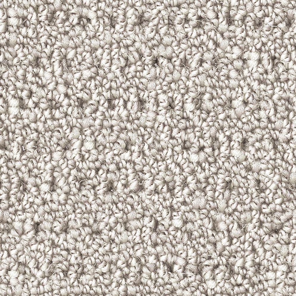 Close-up of beige textured carpet fibers