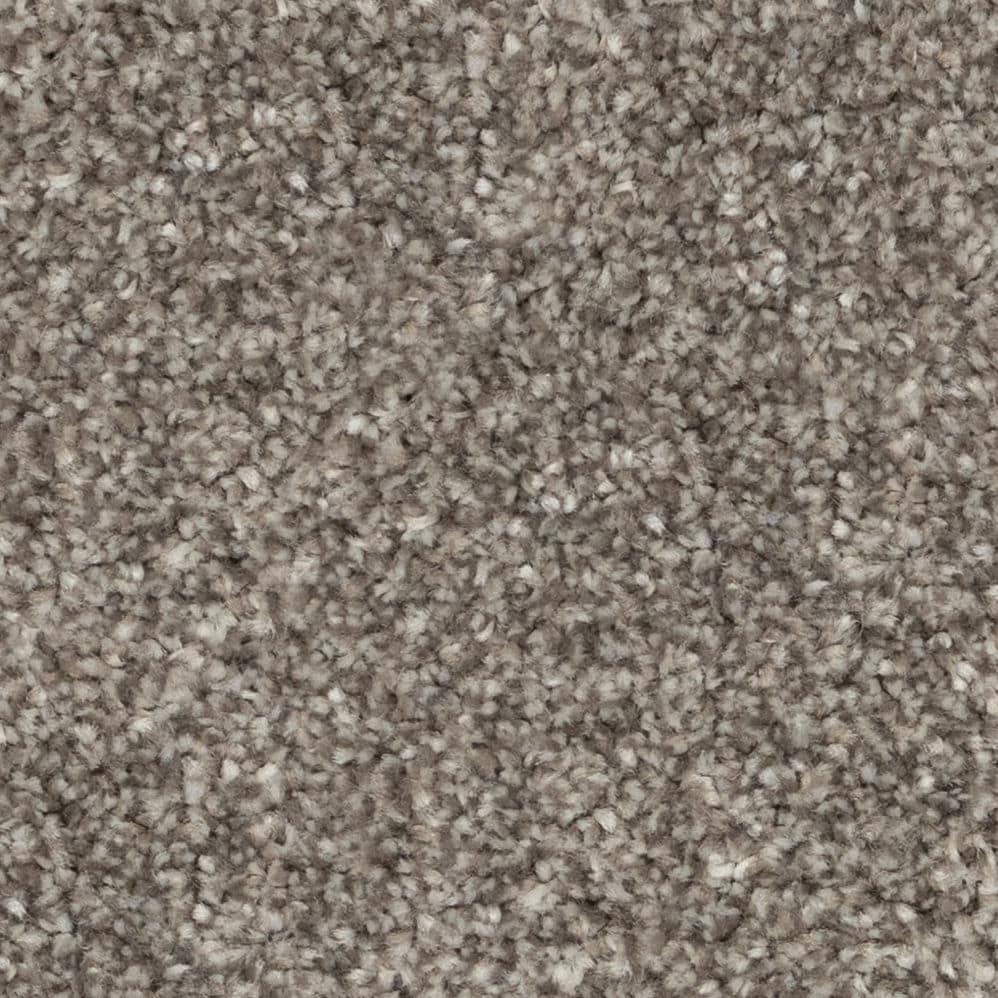 Close-up of beige textured carpet fibers