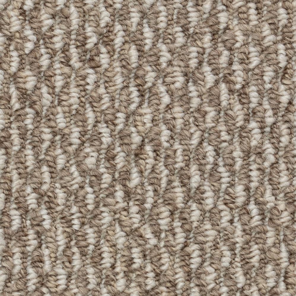 Close-up of beige looped carpet texture