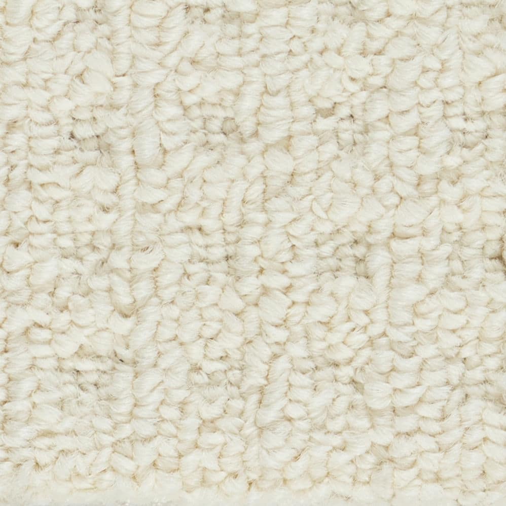 Close-up of cream textured carpet fibers