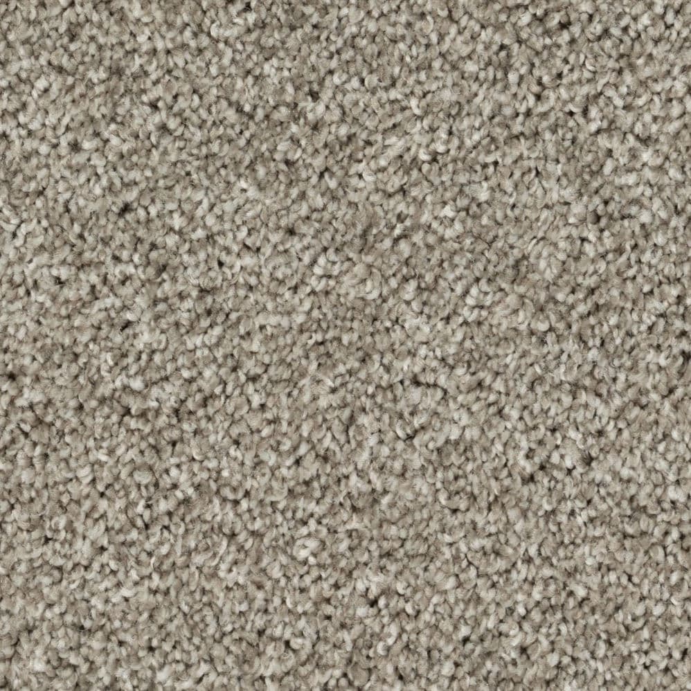 Close-up of beige textured carpet fibers
