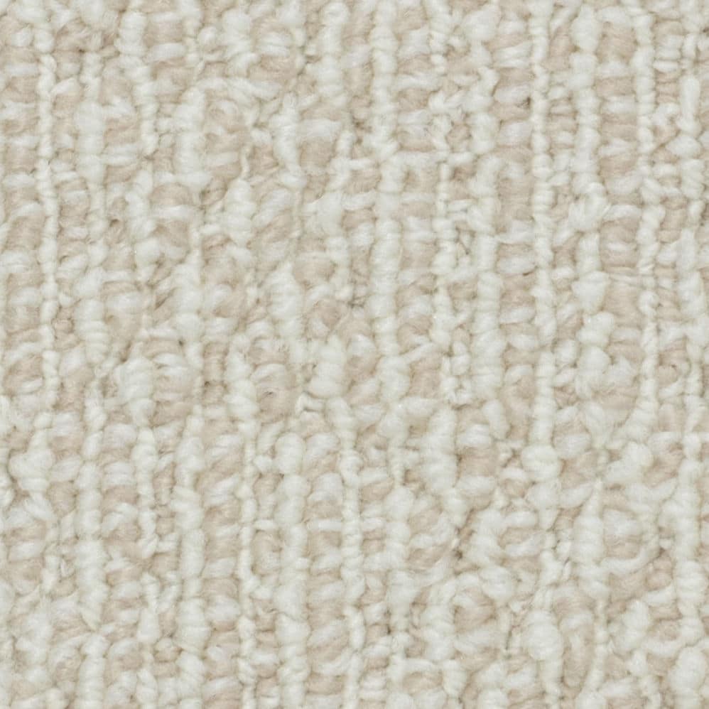 Close-up of beige textured carpet fibers