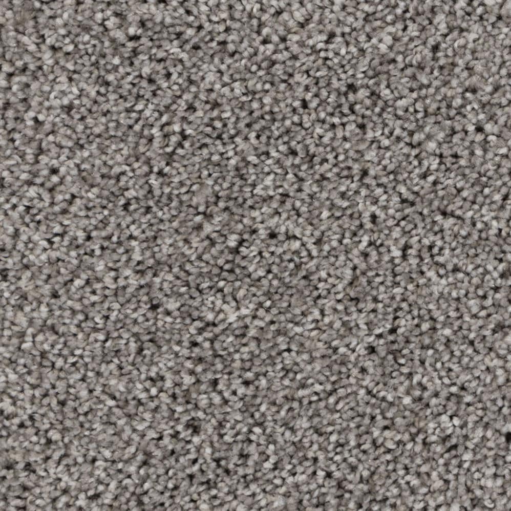 Close-up of gray textured carpet fibers