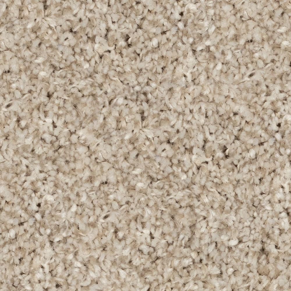 Close-up of beige textured carpet fibers