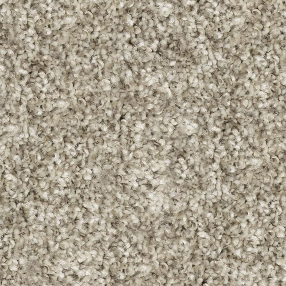 Close-up of beige textured carpet fibers