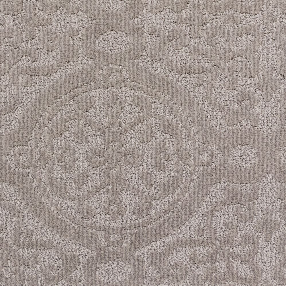 Beige textured carpet with subtle floral pattern
