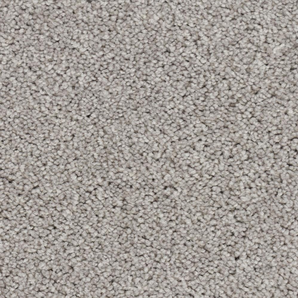 Close-up of light gray textured carpet
