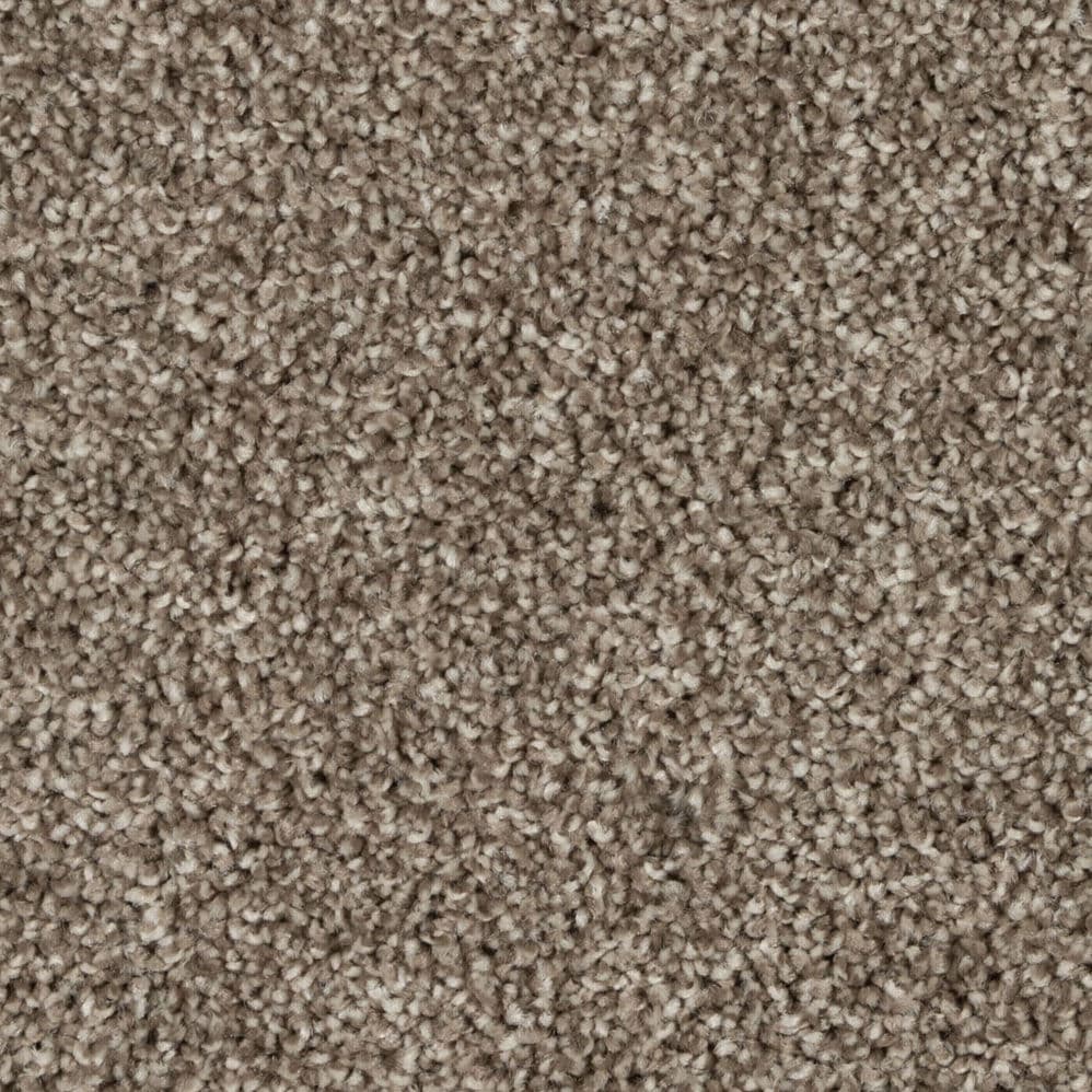 Close-up of beige textured carpet fibers