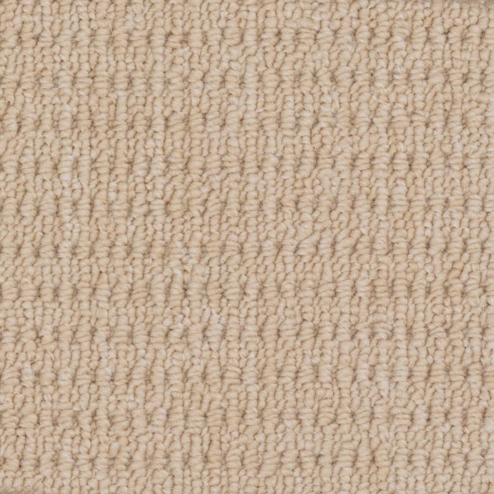 Close-up of beige textured carpet surface