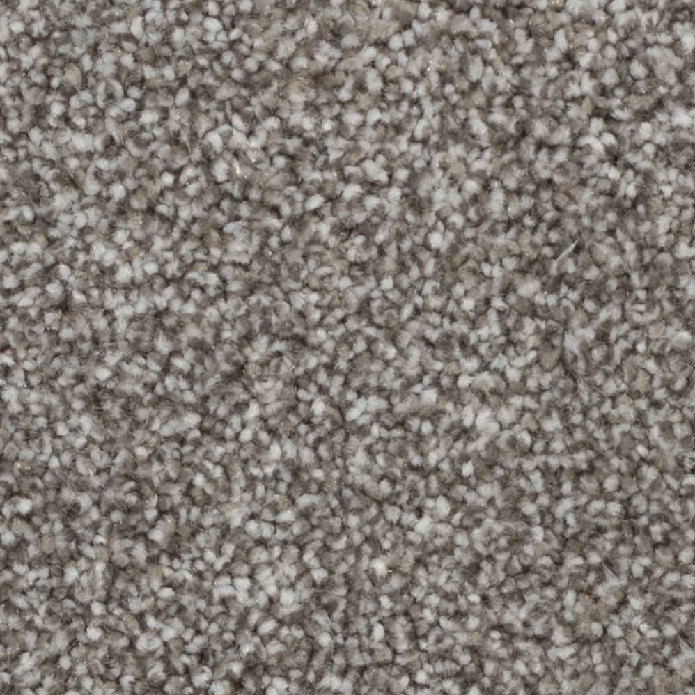 Close-up of beige textured carpet fibers