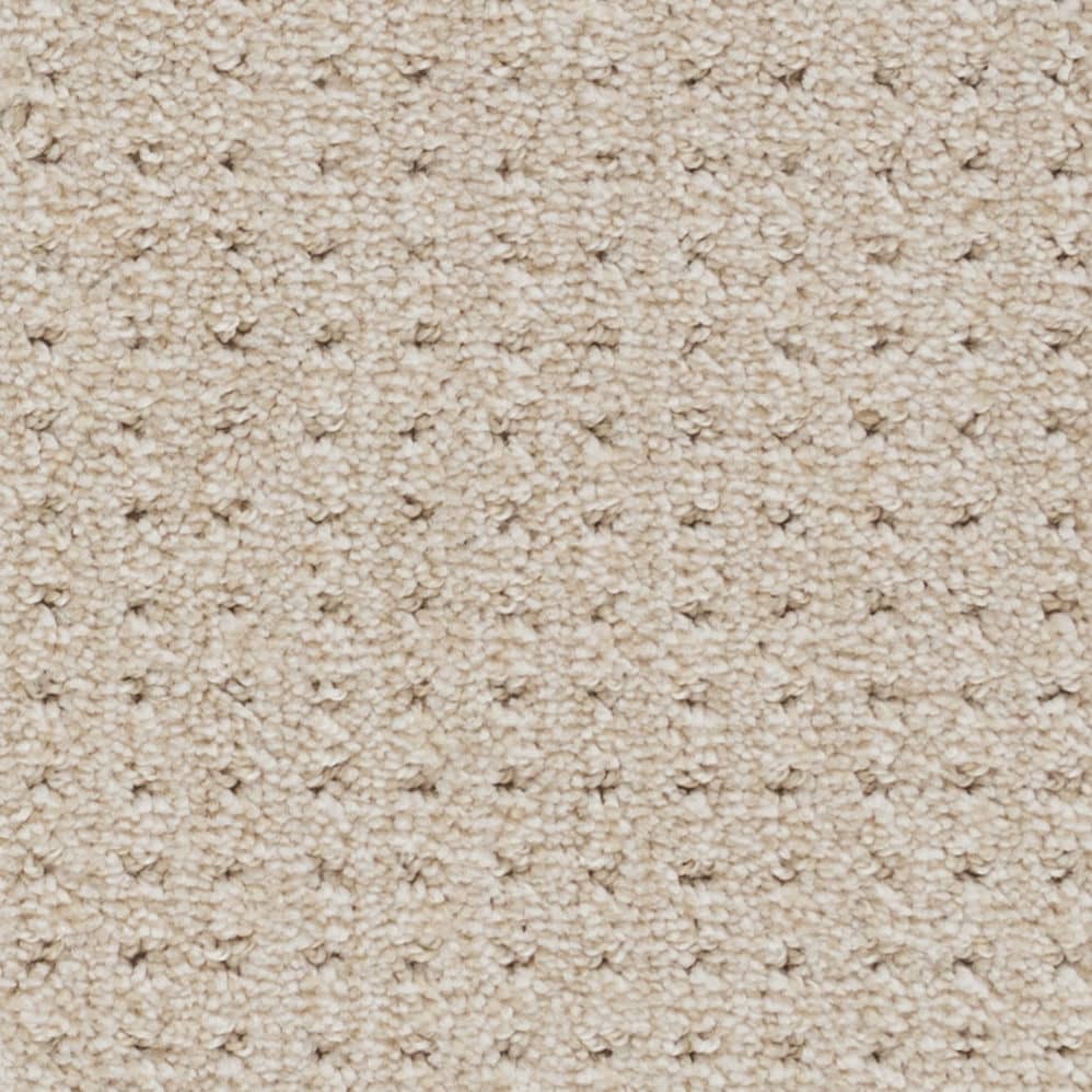 Close-up of beige textured carpet surface