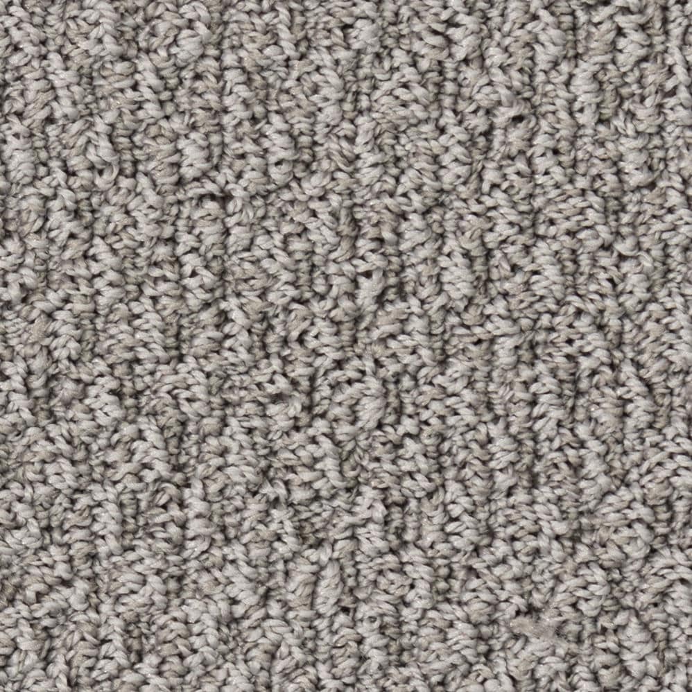 Close-up of gray textured carpet fibers