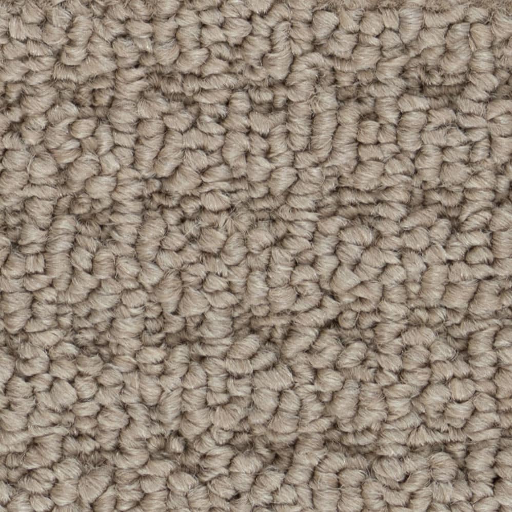 Close-up of beige textured carpet fibers
