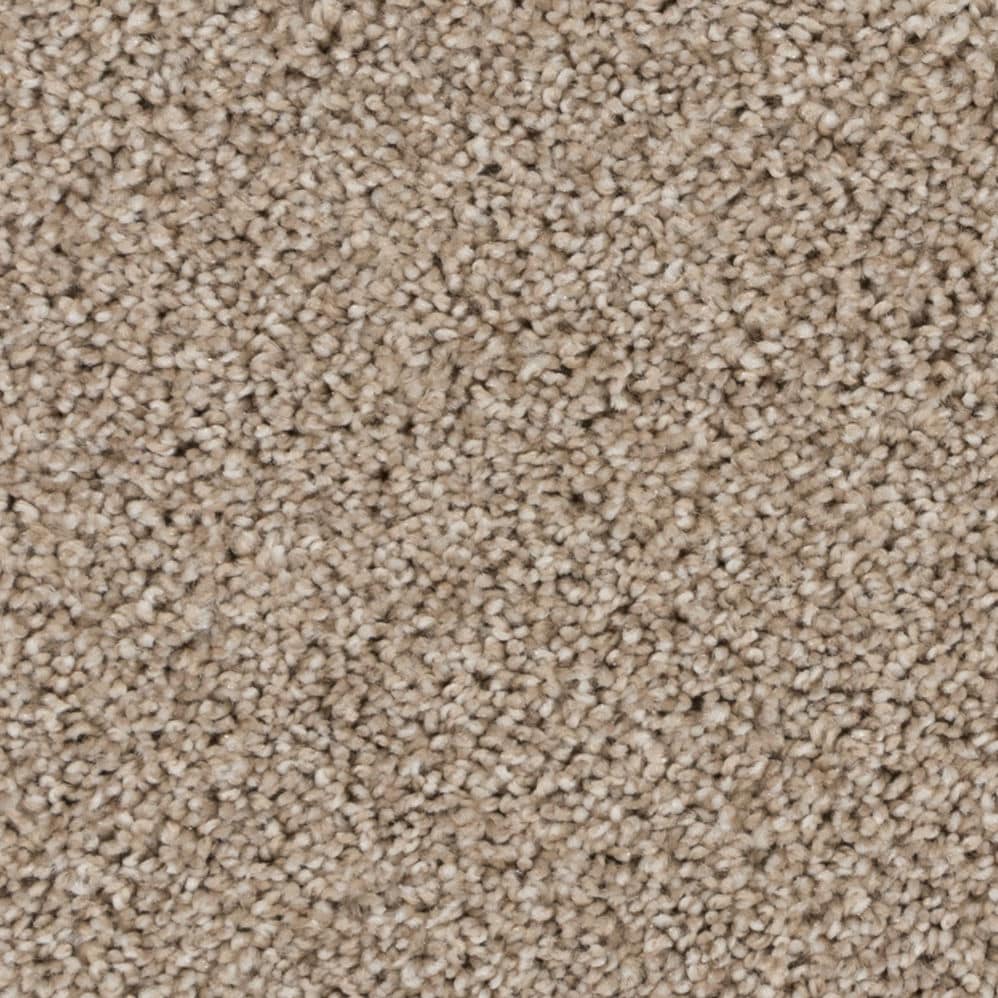 Close-up of beige textured carpet fibers
