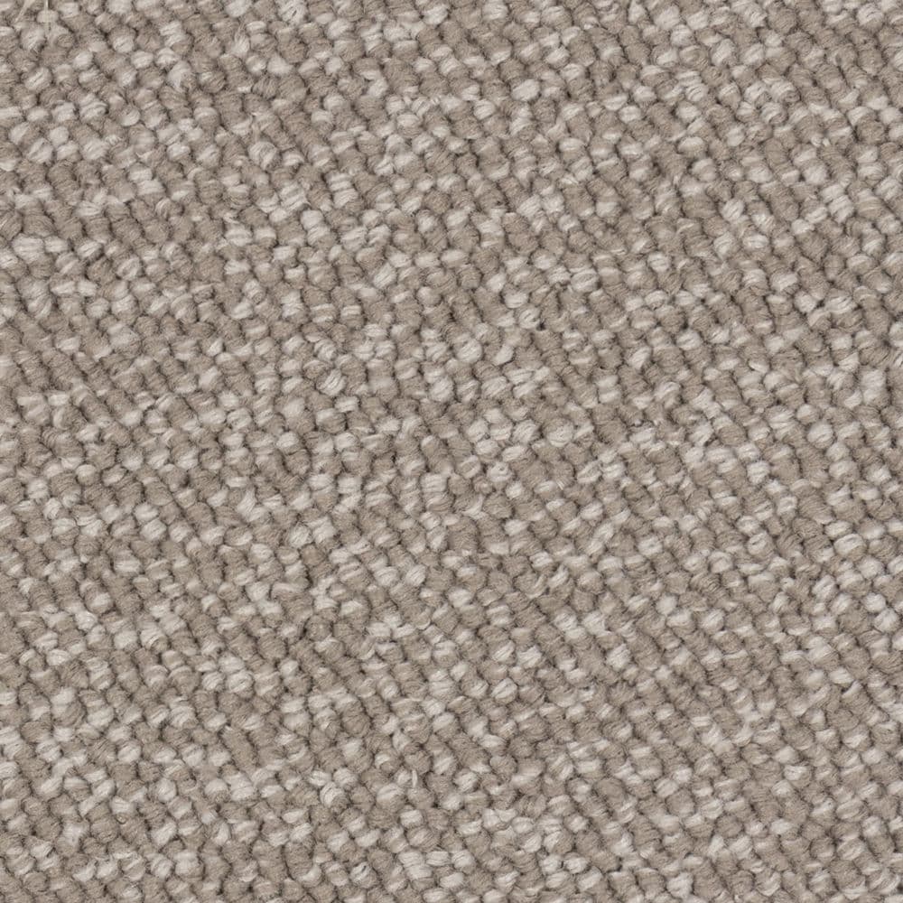 Close-up of beige textured carpet fibers