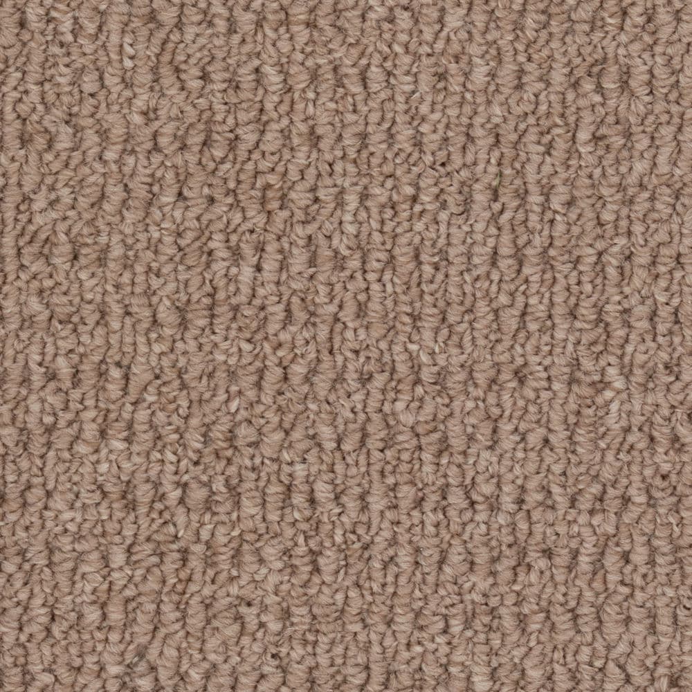 Close-up of beige textured carpet fibers