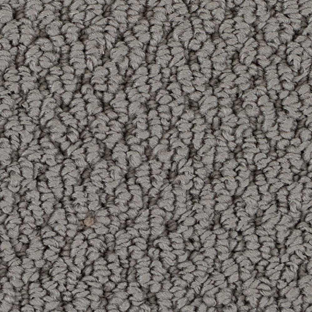 Close-up of gray textured carpet fibers