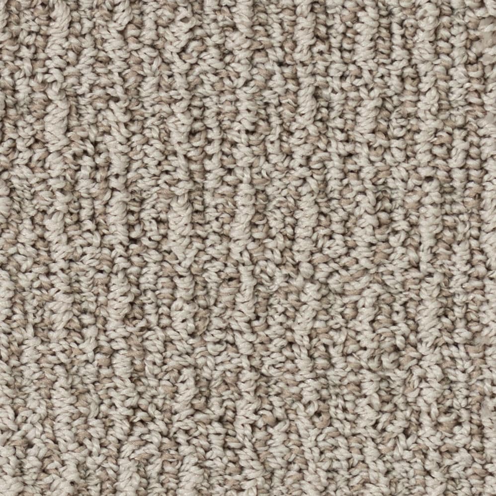 Close-up of beige textured carpet fibers