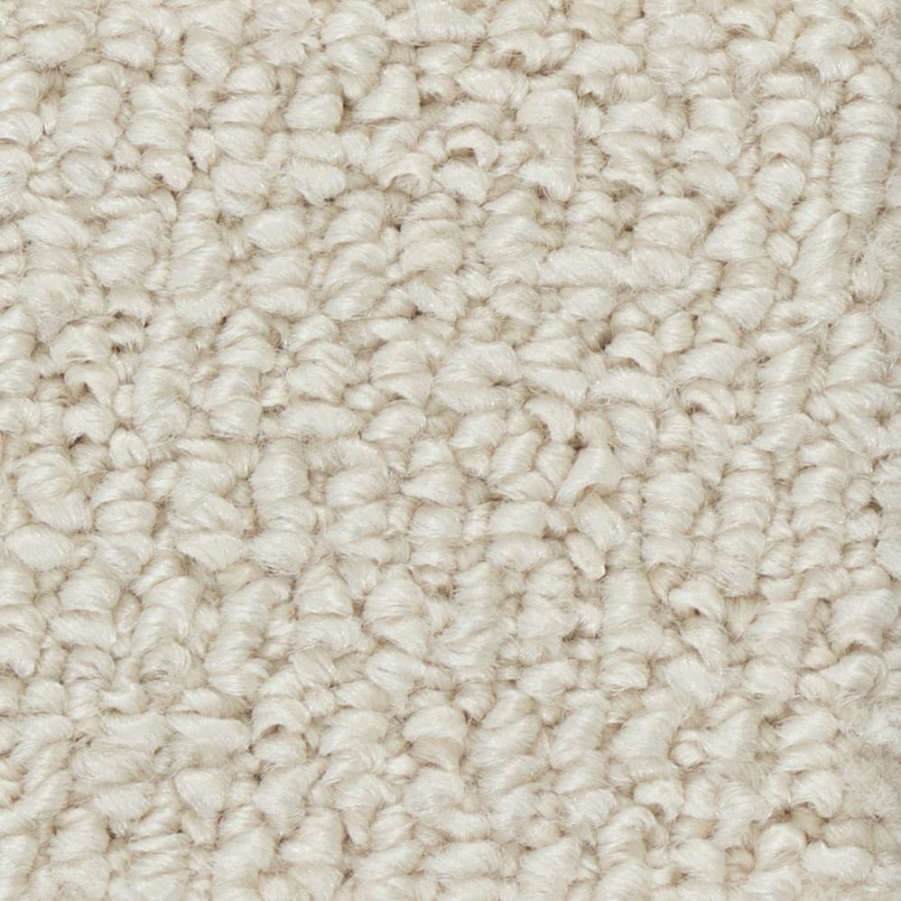 Close-up of beige textured carpet fibers