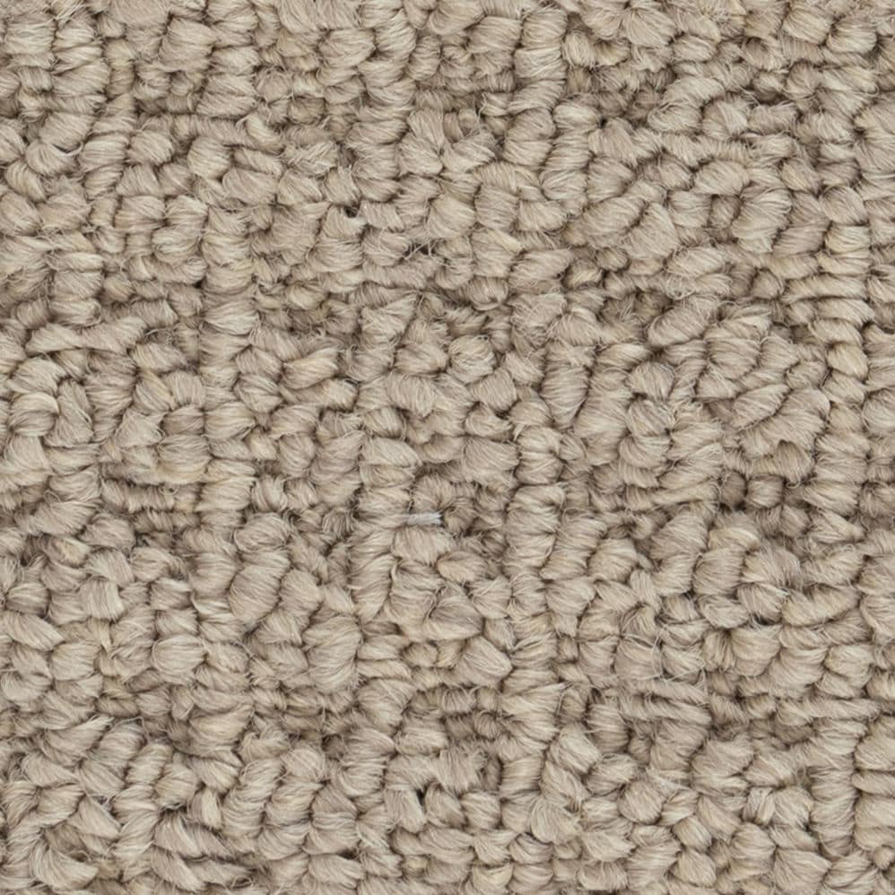 Close-up of beige looped carpet texture