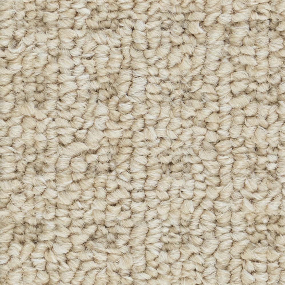 Close-up of beige loop pile carpet texture