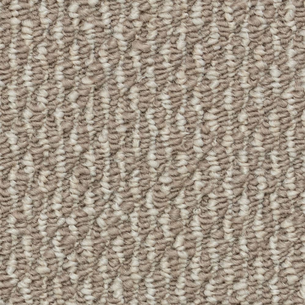 Close-up of beige textured carpet fibers