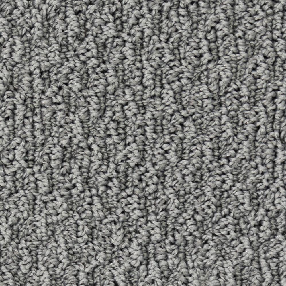 Close-up of gray textured carpet fibers