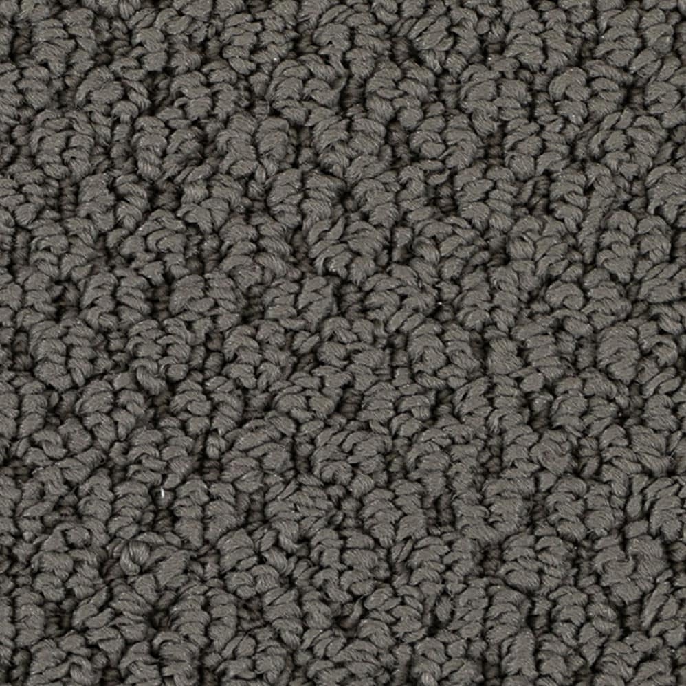 Close-up of gray textured carpet fibers