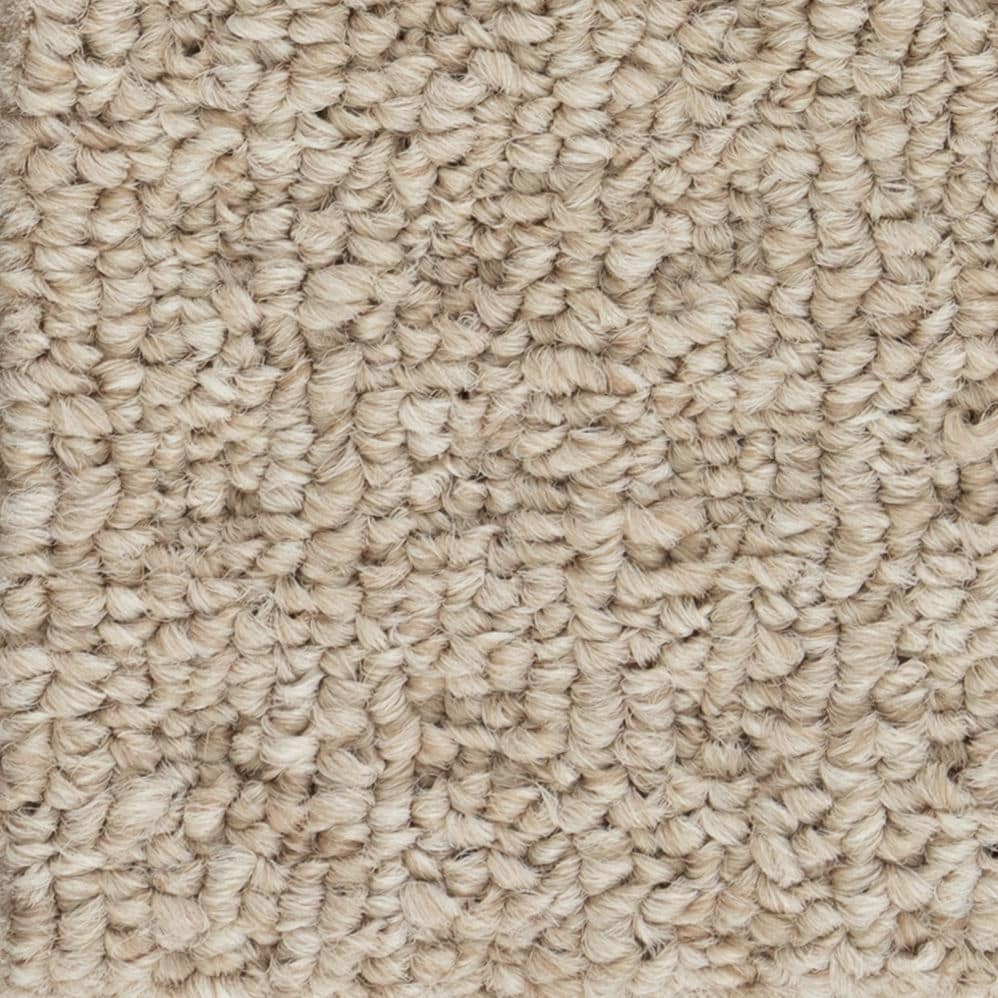 Close-up of beige looped carpet texture