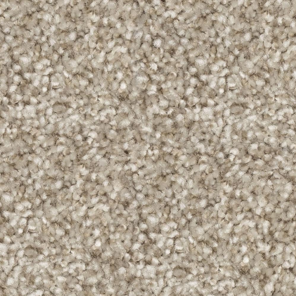 Close-up of beige textured carpet fibers