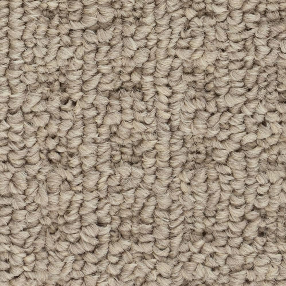 Close-up of beige loop pile carpet texture