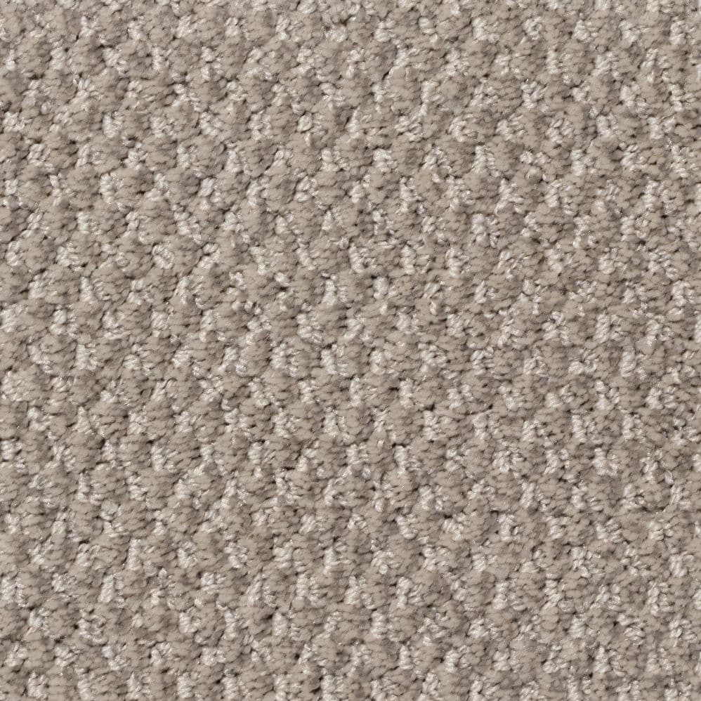 Close-up of beige textured carpet surface