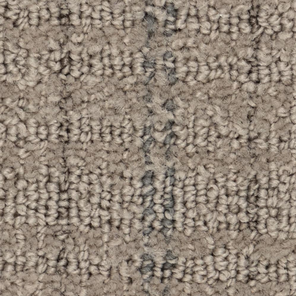 Close-up of beige textured carpet with seam