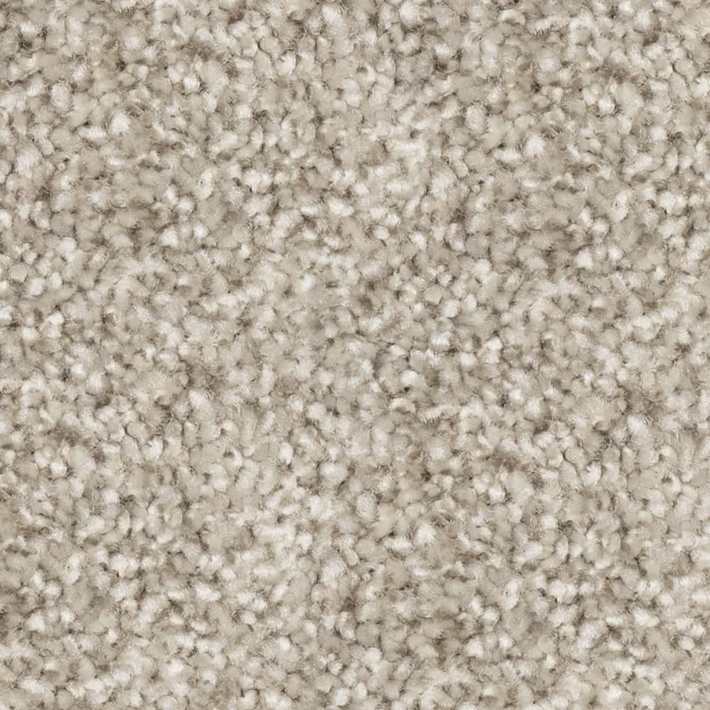 Close-up of beige textured carpet fibers