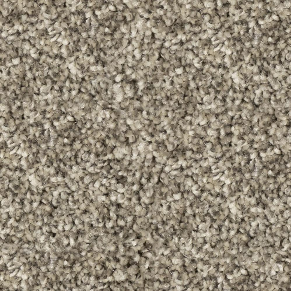 Close-up of beige textured carpet fibers