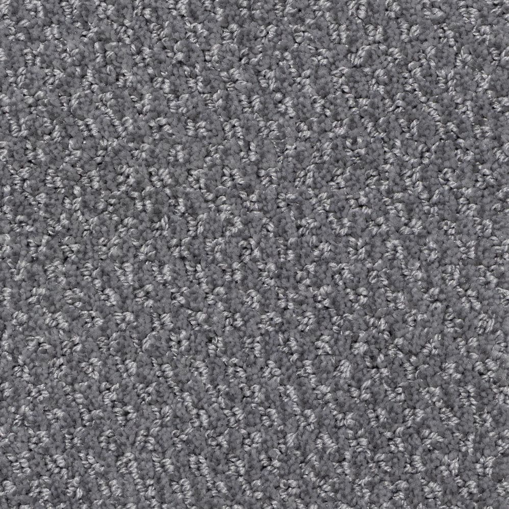 Close-up of gray textured carpet fibers