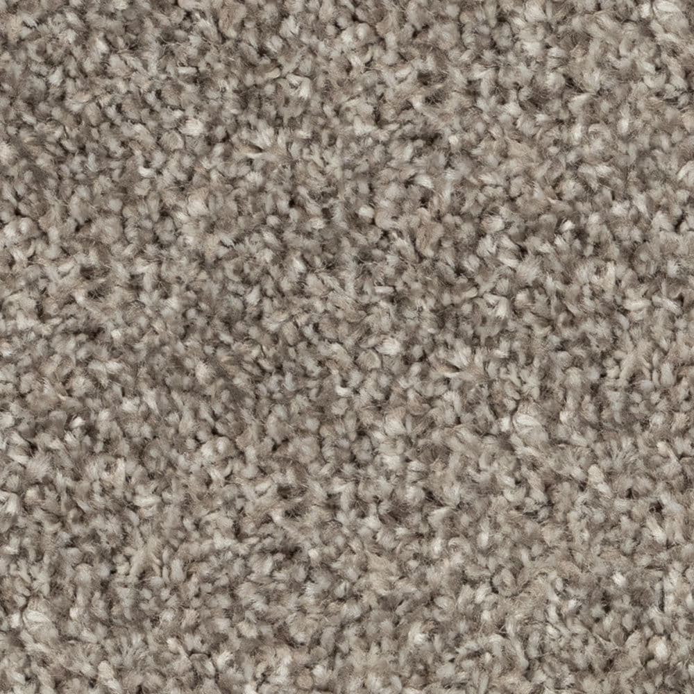 Close-up of beige textured carpet fibers