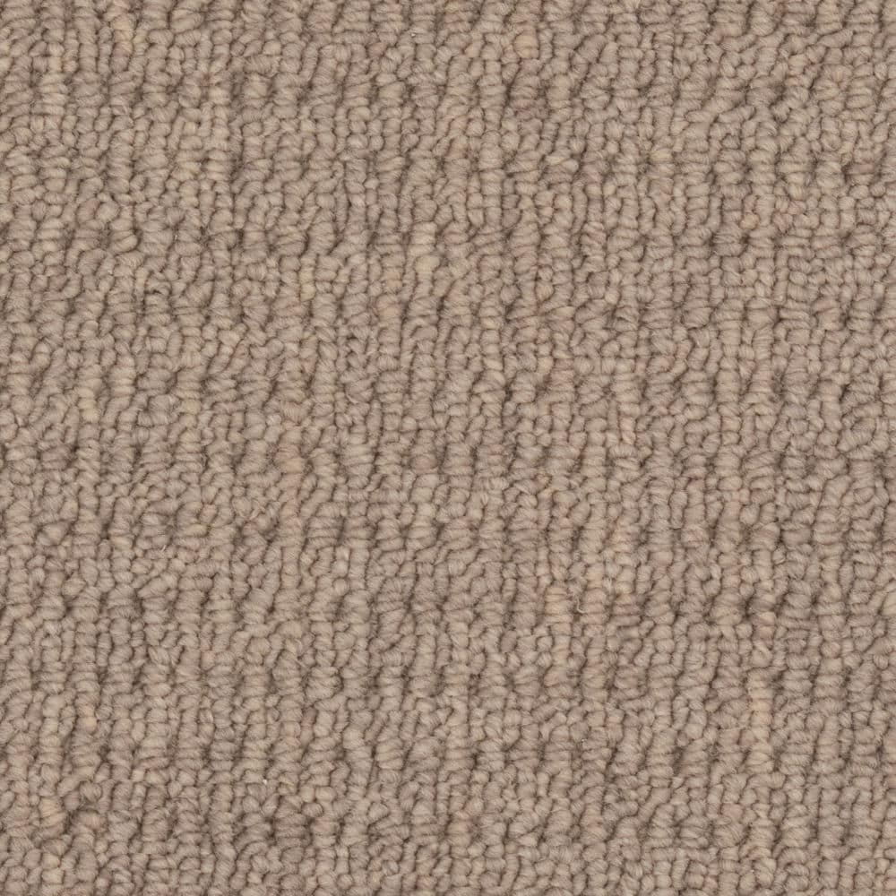 Close-up of beige textured carpet surface