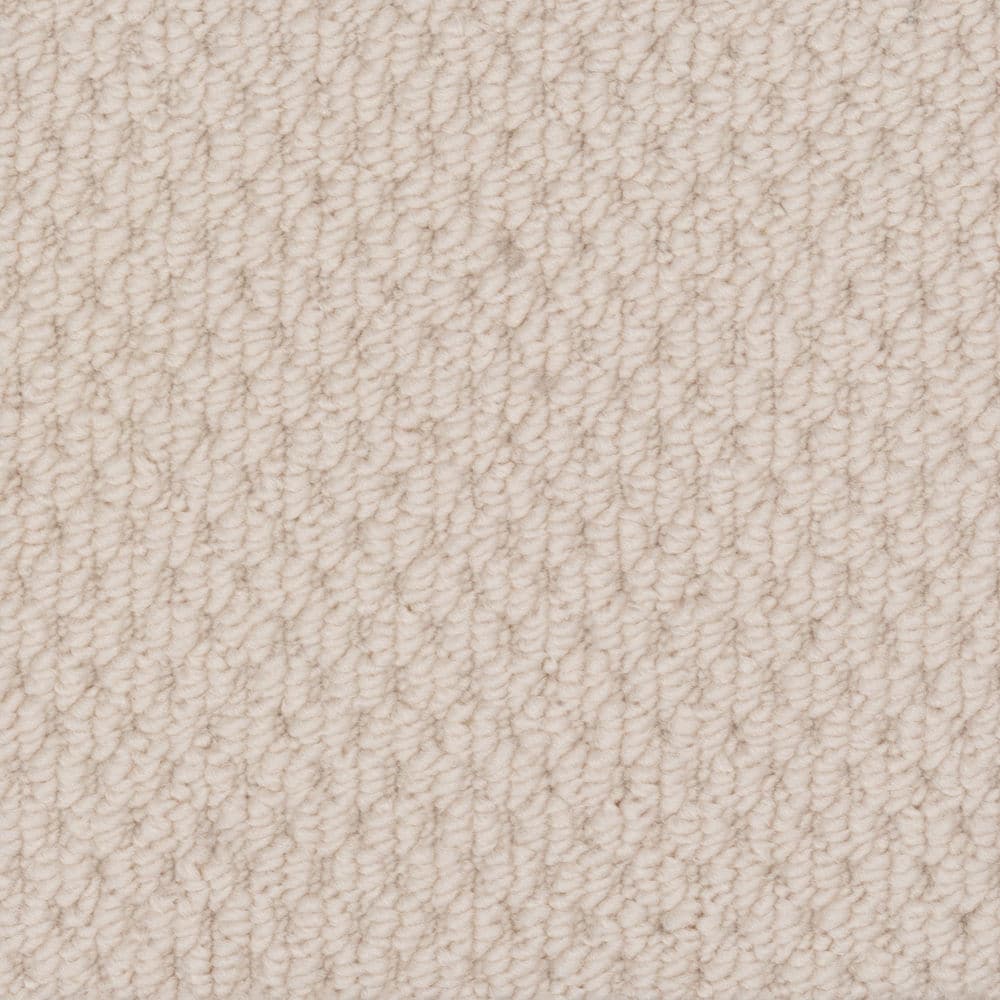 Close-up of beige textured loop carpet