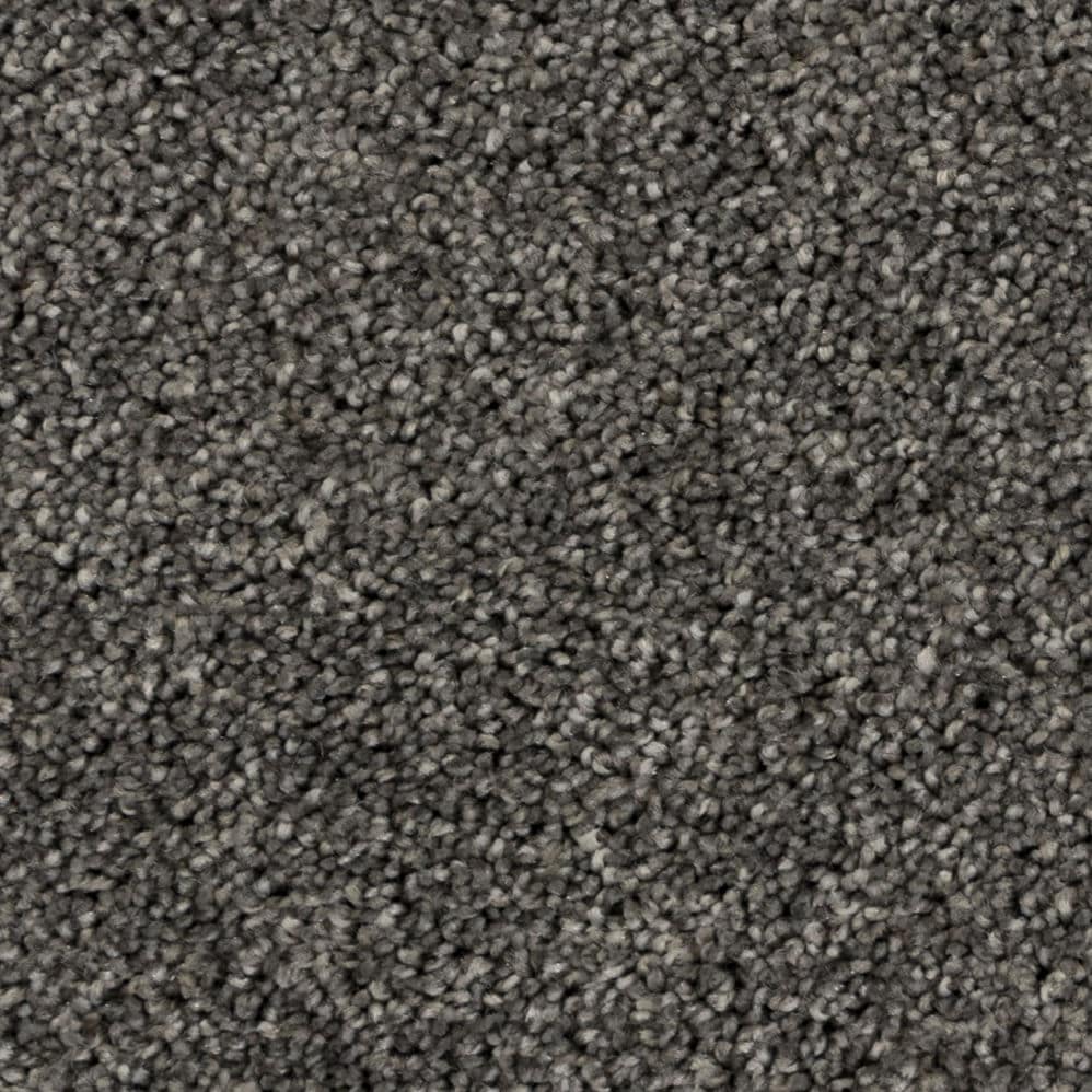 Close-up of gray textured carpet fibers