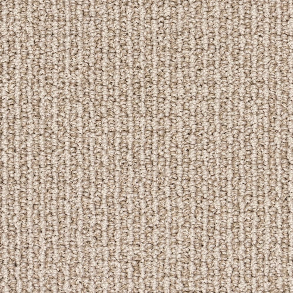 Close-up of beige textured loop pile carpet