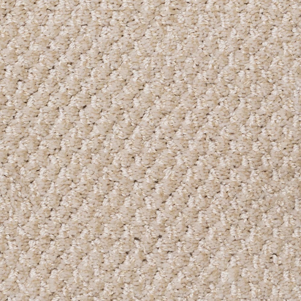 Close-up of beige plush carpet texture