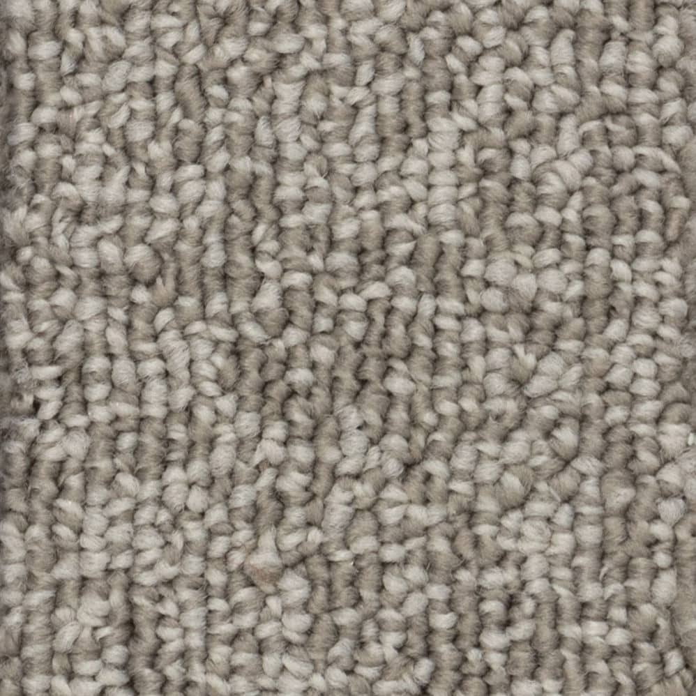 Close-up of beige textured carpet fibers
